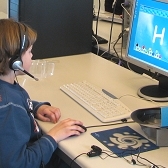 Child studying at a computer