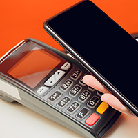 A credit card payment terminal and a smartphone