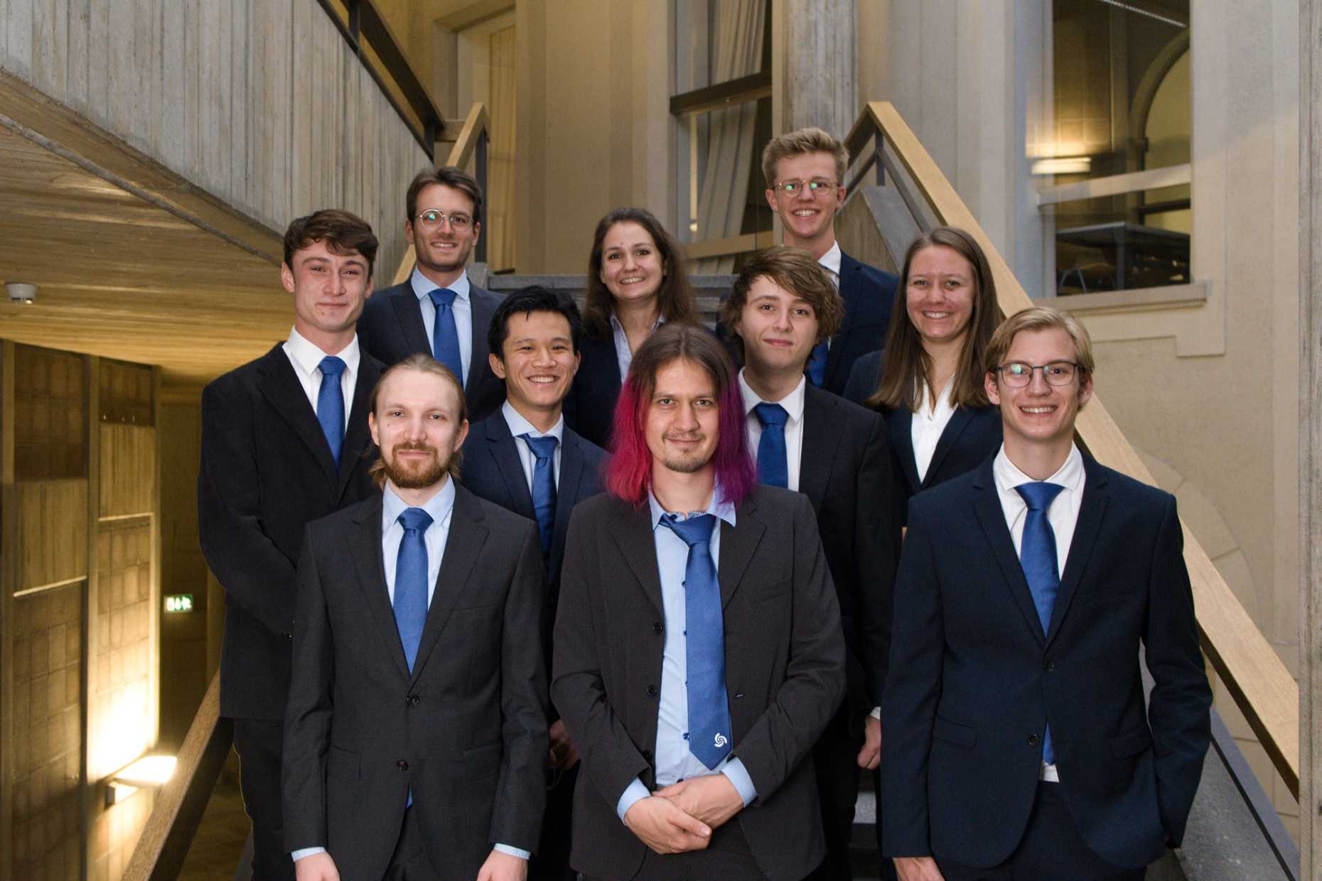Enlarged view: Organising committee for the Kontaktparty 2022 wearing suits on the stairs in the ETH main building.