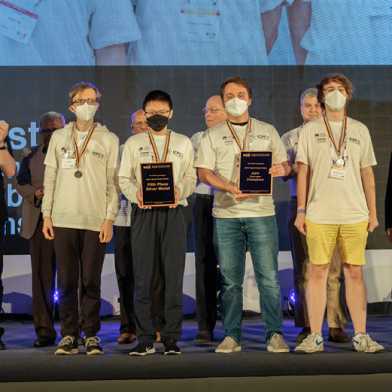 The team members receive their silver medal. Photo: ICPC