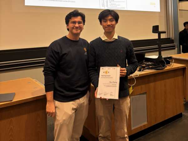 A teaching assistant receiving an award.