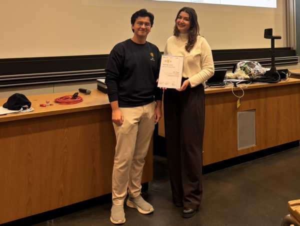 A teaching assistant receiving an award.