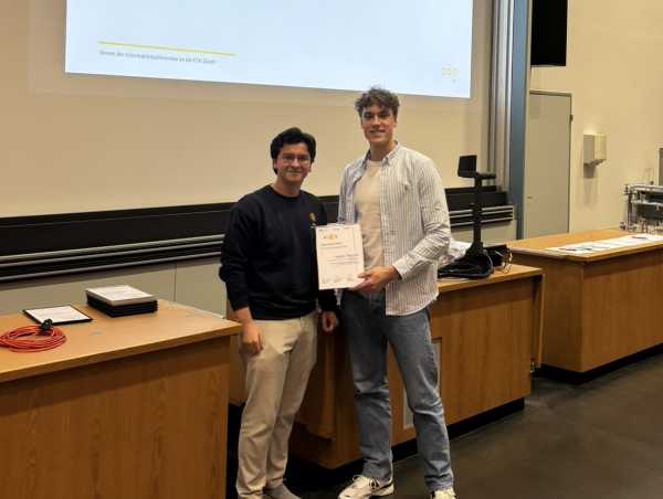 A teaching assistant receiving an award.