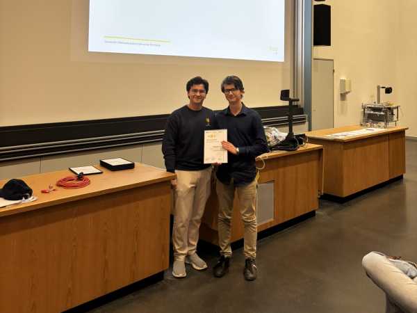 A teaching assistant receiving an award.