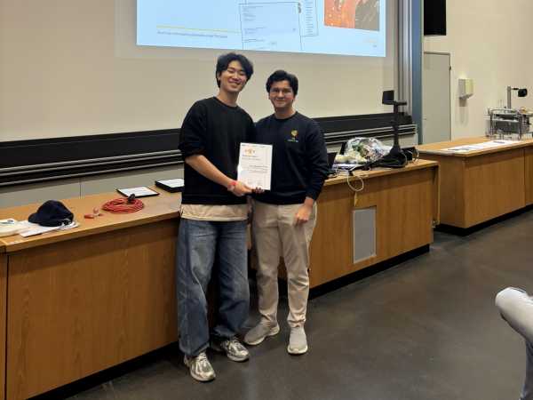 A teaching assistant receiving an award.