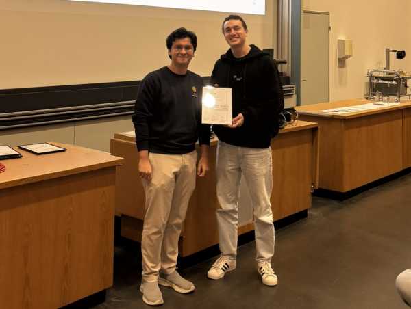 A teaching assistant receiving an award.