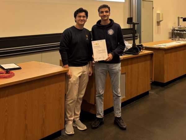 A teaching assistant receiving an award.
